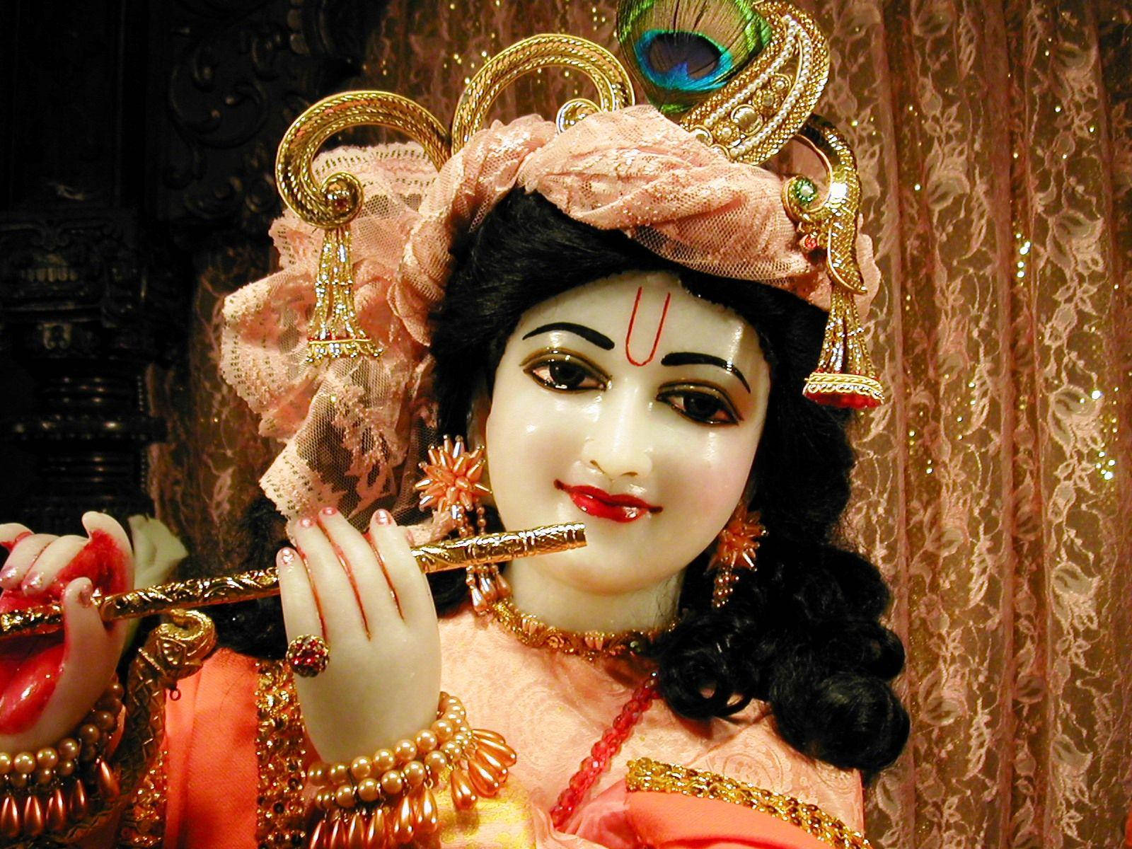 Divine Statue Of Krishna On Desktop Wallpaper