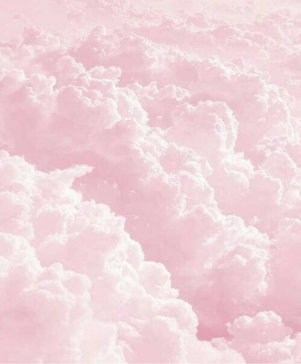 Dreamy Pastel Ipad Wallpaper With Thick Pink Clouds Wallpaper