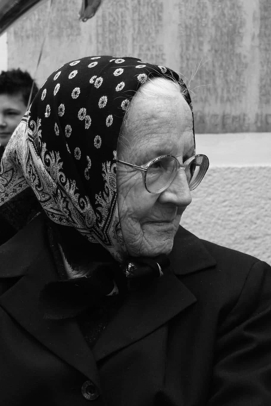 Elderly Womanin Scarfand Glasses Wallpaper