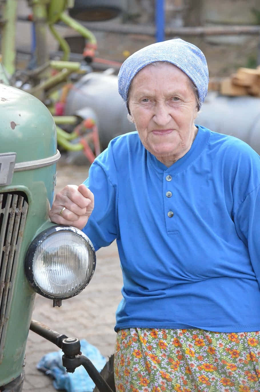 Elderly Womanwith Vintage Tractor Wallpaper