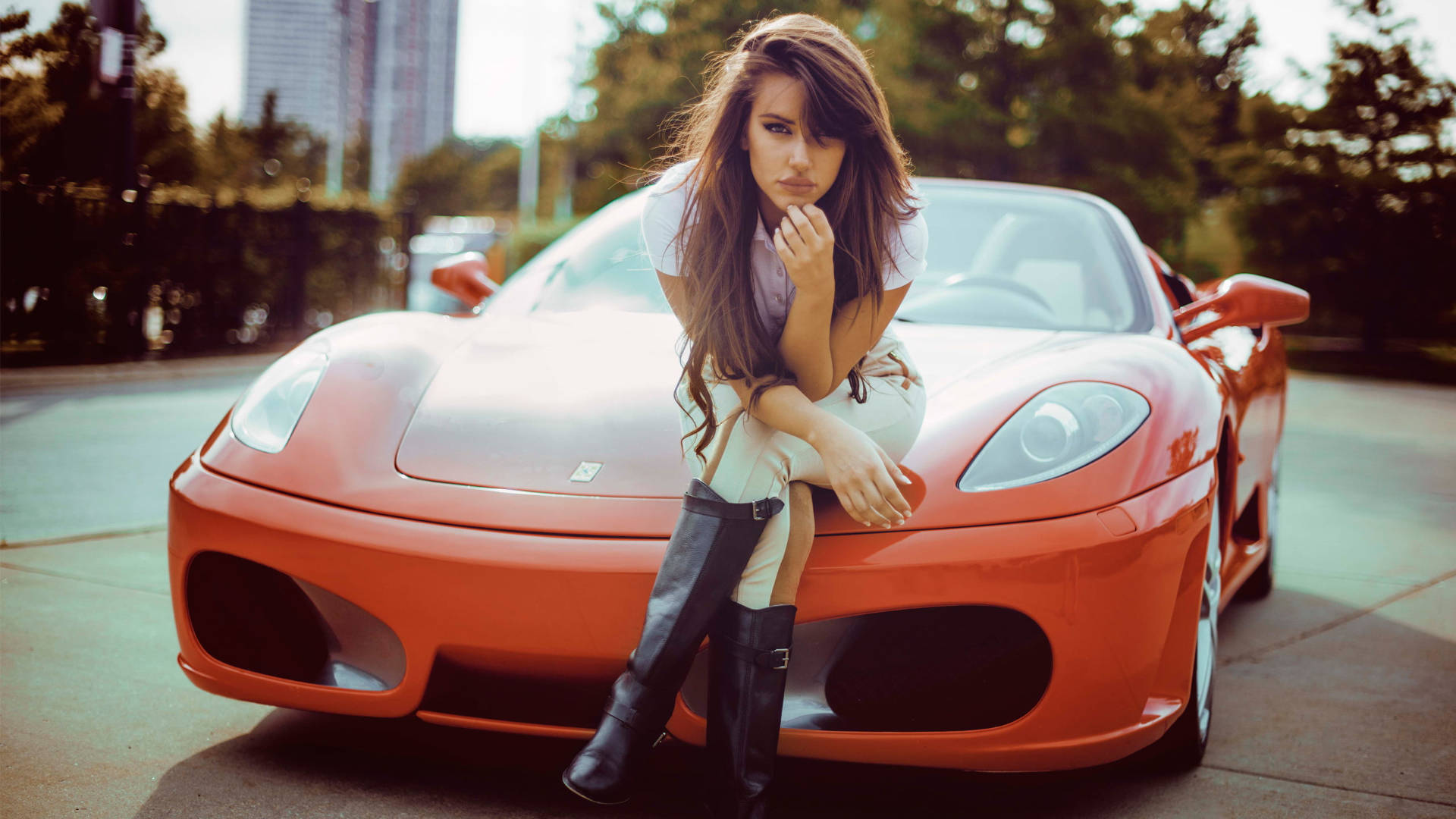 Elegant Woman With Ferrari Ipad On A Vintage Red Ferrari Wallpaper