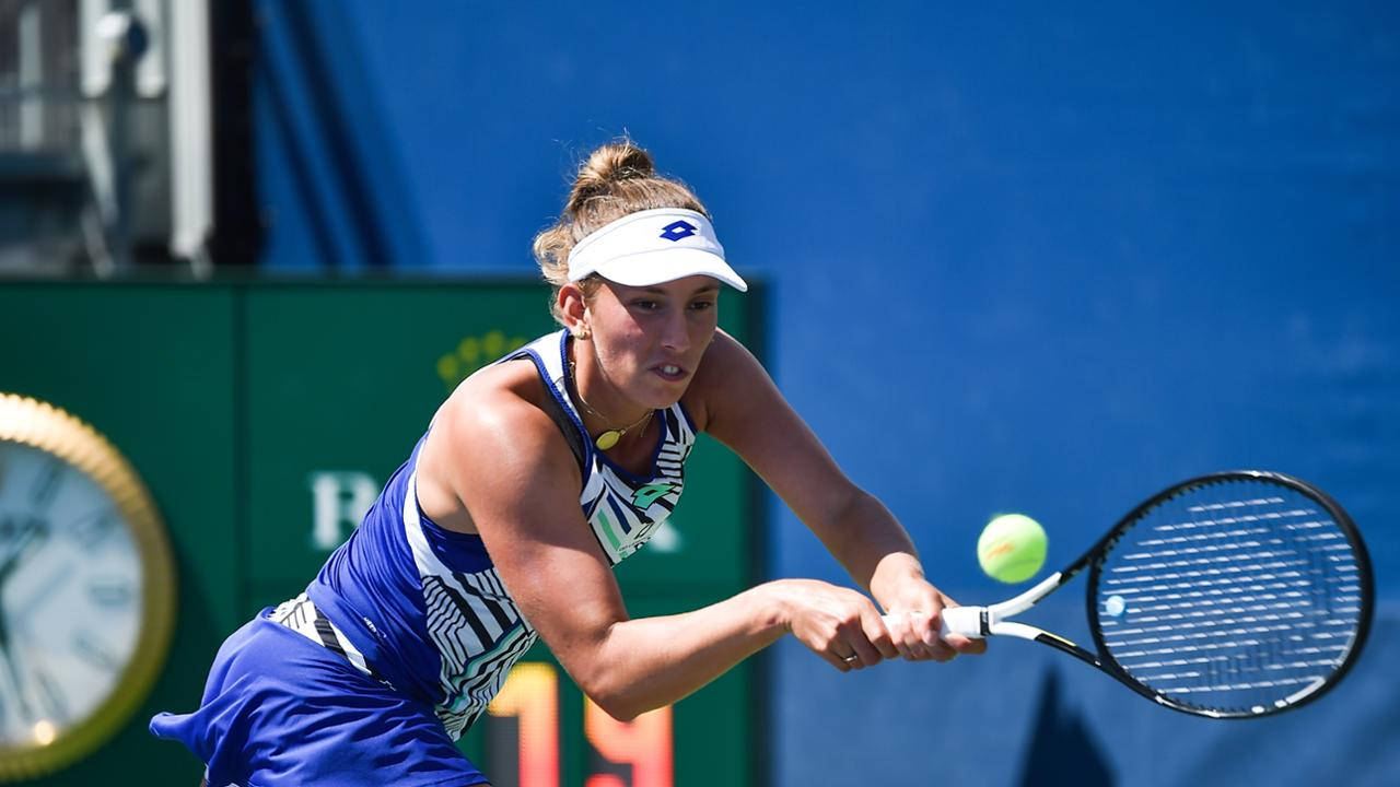 Elise Mertens In Action, Executing A Double Handed Receive Wallpaper