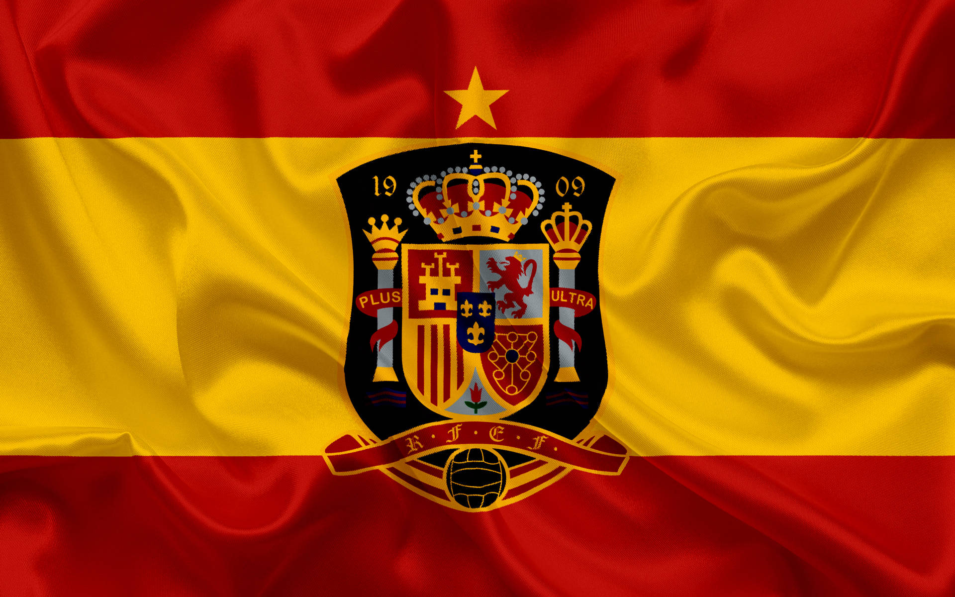 Embodying Spirit & Pride - Spain National Football Team Emblazoned Insignia Wallpaper