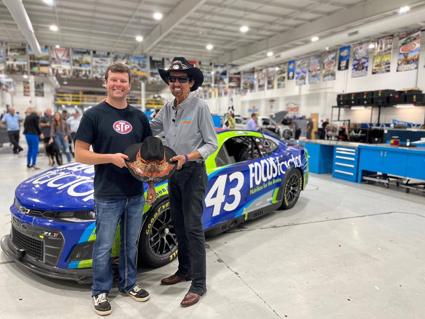 Erik Jones With A Man With Cowboy Hat Wallpaper