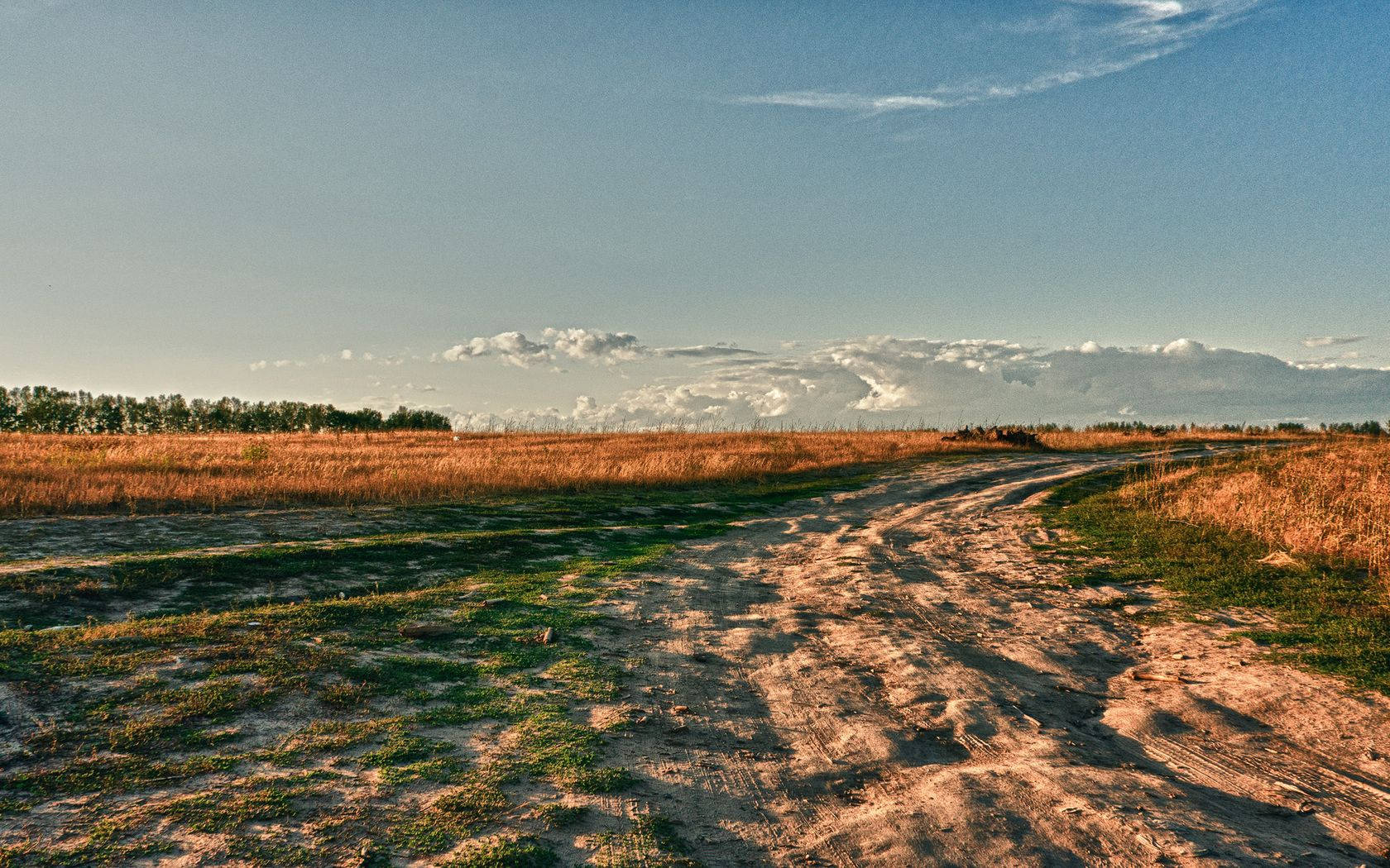 Exploring The Rugged Beauty Of Country Roads Wallpaper