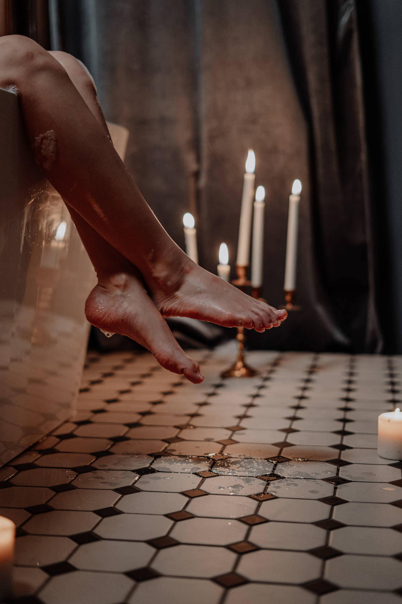 Feet Dangling On A Bathtub Wallpaper