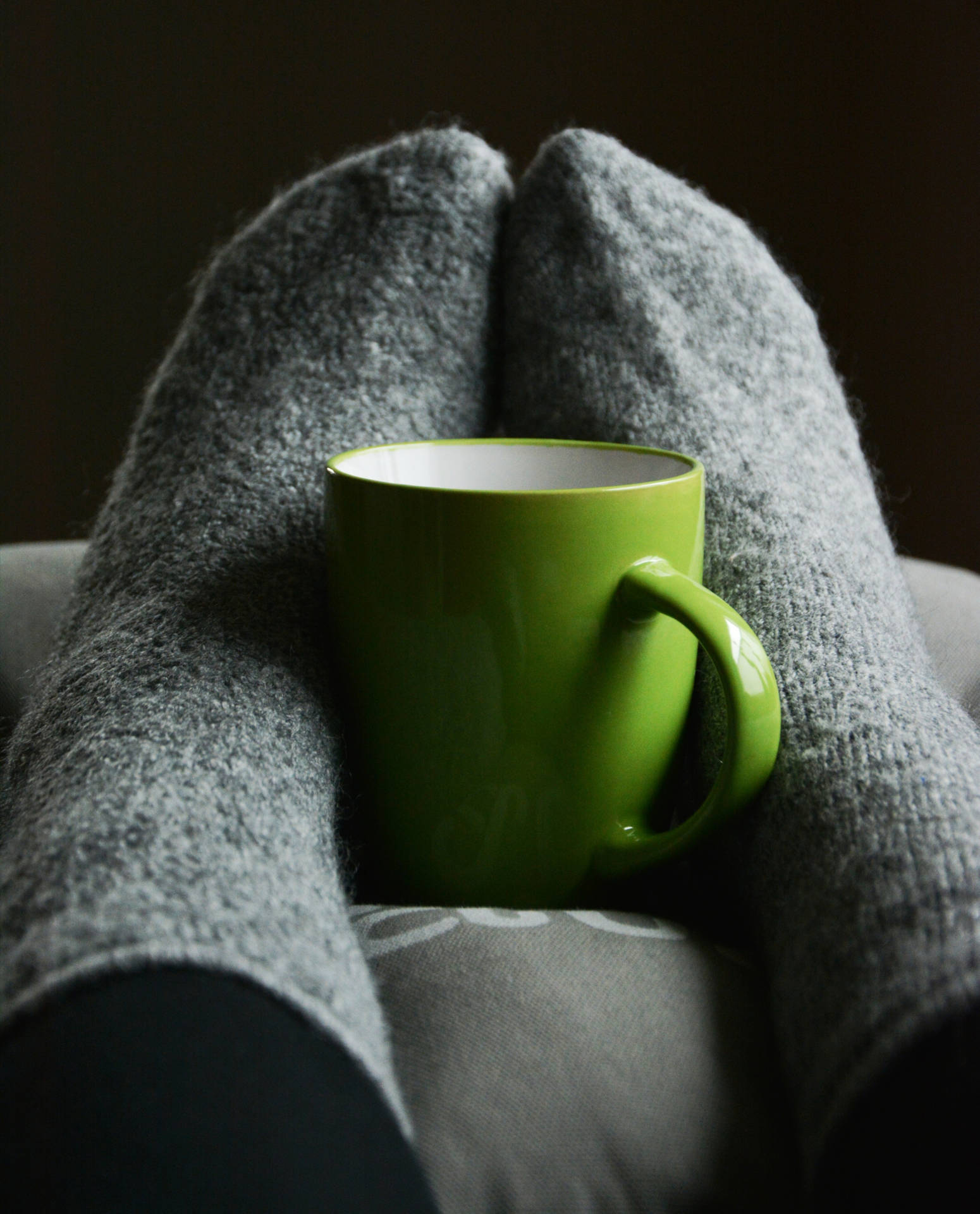 Feet In Cozy Grey Socks Wallpaper