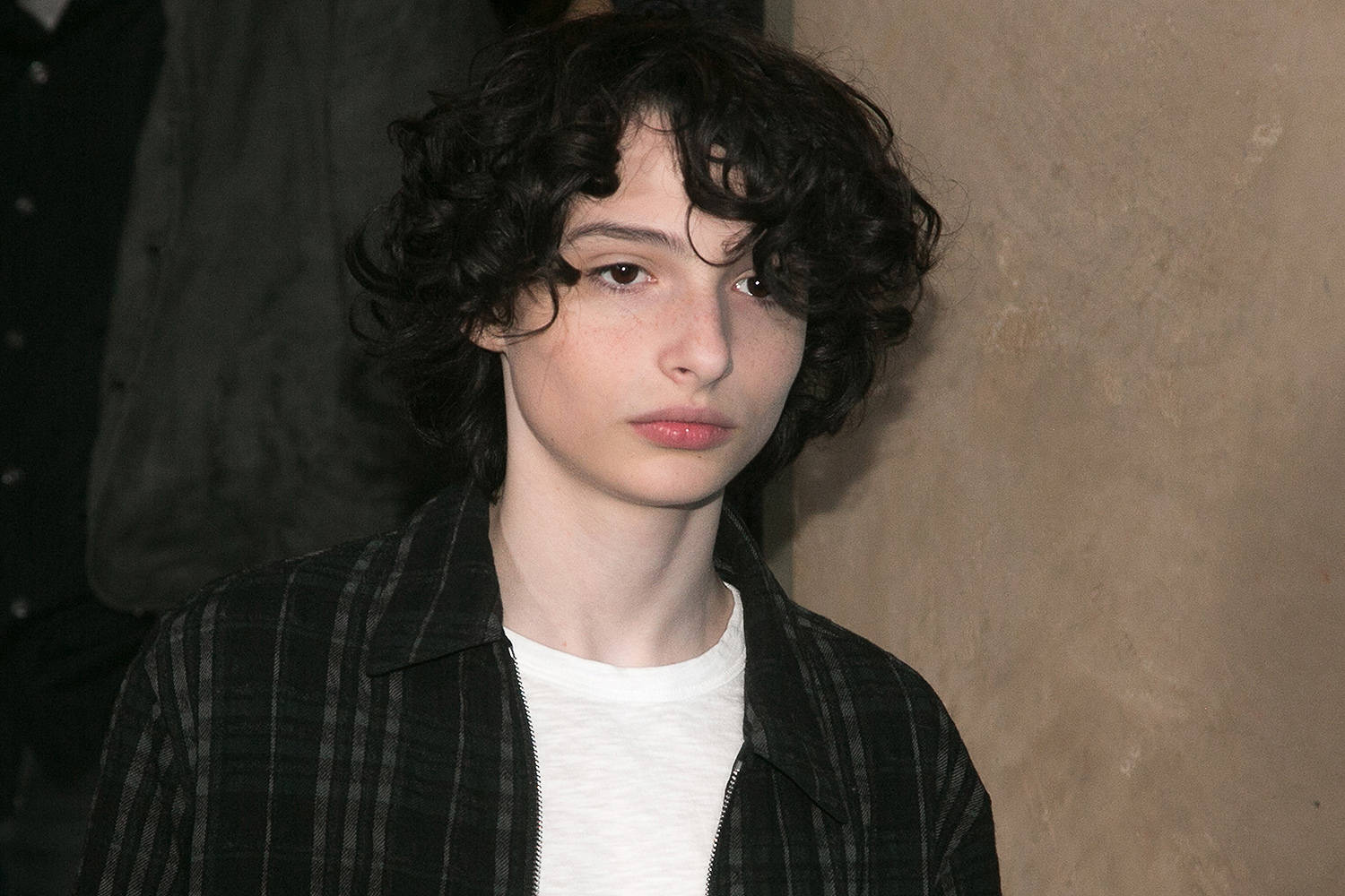 Finn Wolfhard Serious Look Wallpaper