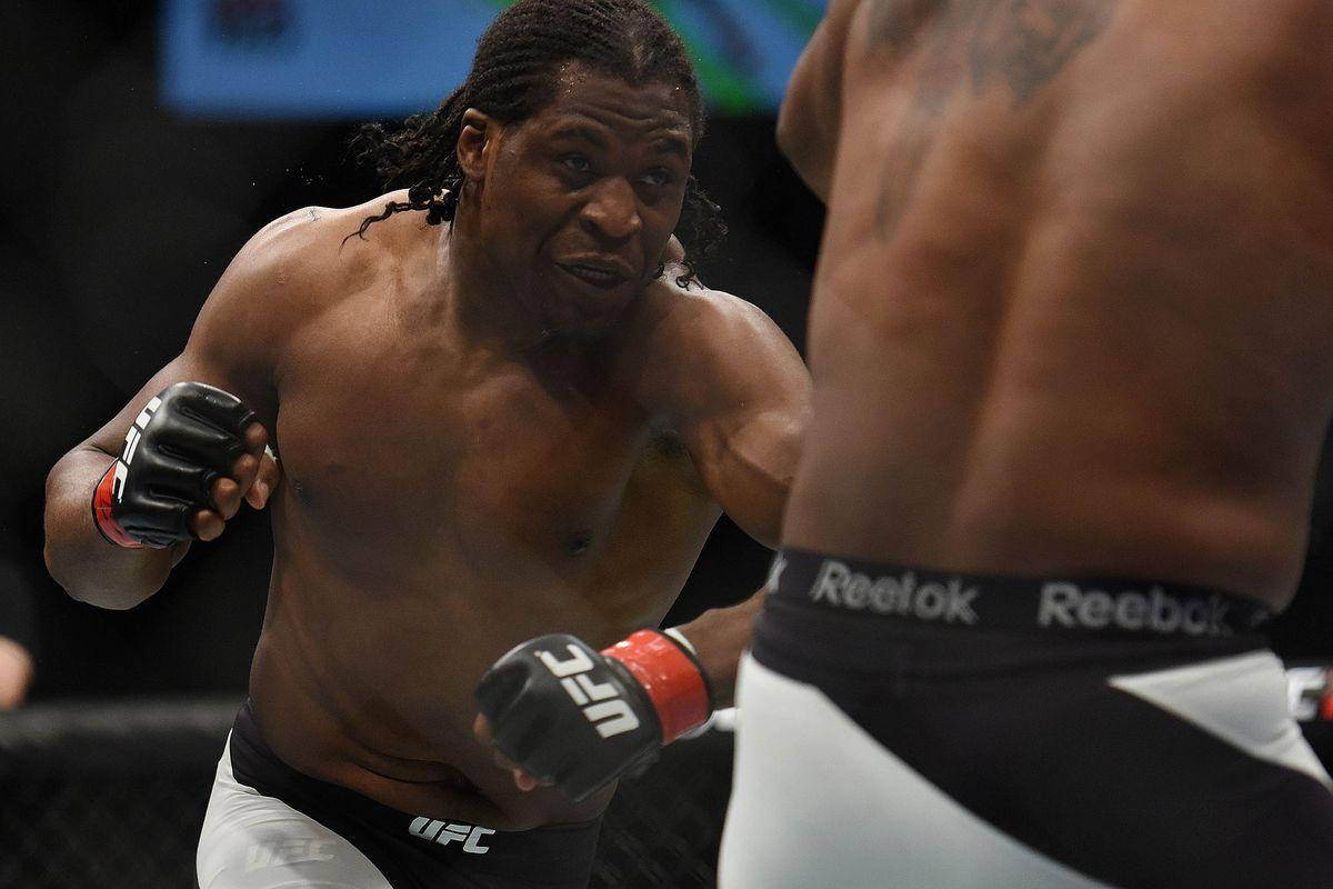 Francis Ngannou Bracing For Action In Octagon Wallpaper