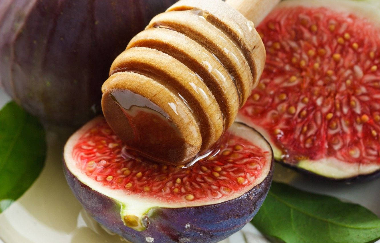 Fresh And Juicy Figs Immersed In Sweet Syrup Wallpaper