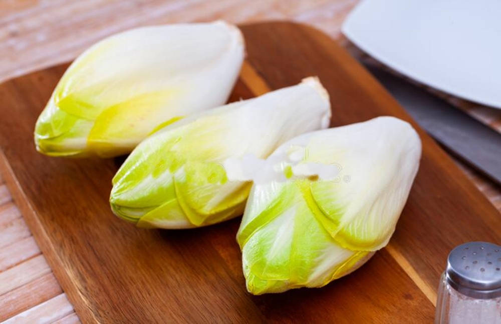 Fresh Belgian Endive Vegetables On A Wooden Board Wallpaper