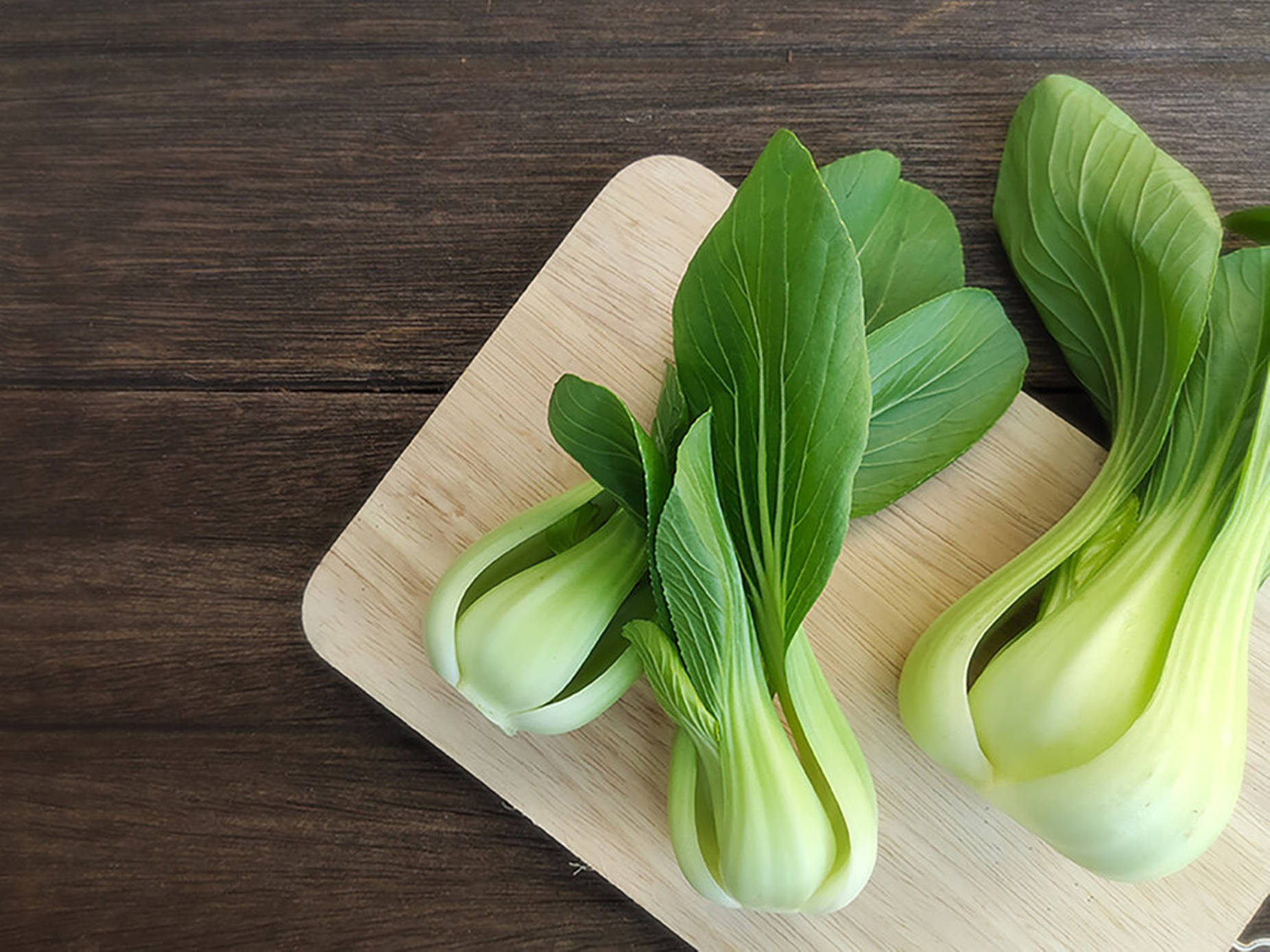 Fresh Bok Choy On Chopping Board Wallpaper