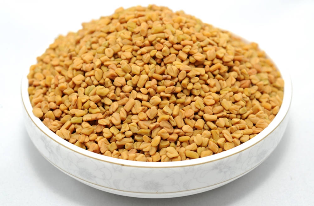 Fresh Fenugreek Seeds In Wide Bowl Wallpaper