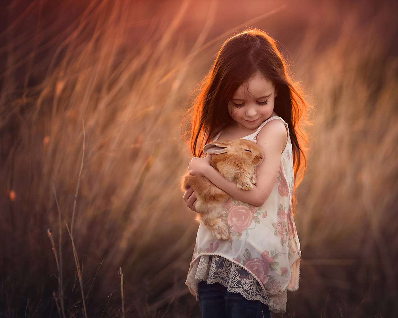 Girl Child Holding A Rabbit Wallpaper