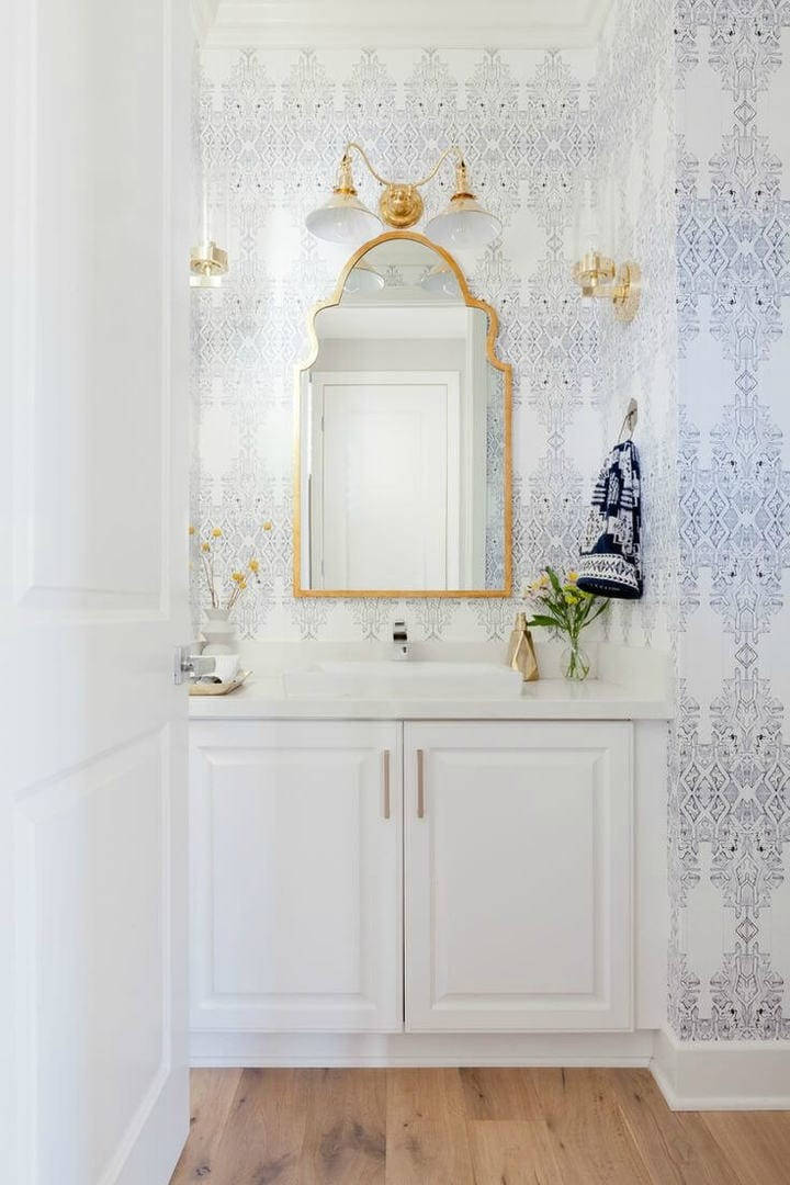 Golden Frame Mirror In A Boho Beachside Bathroom Wallpaper