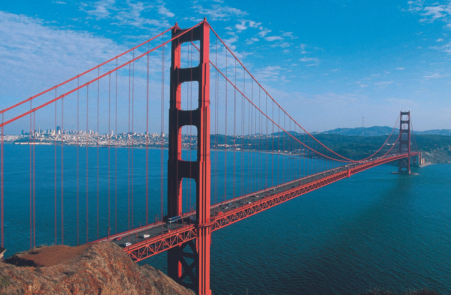 Golden Gate Bridge Suspended Over Blue Water Wallpaper