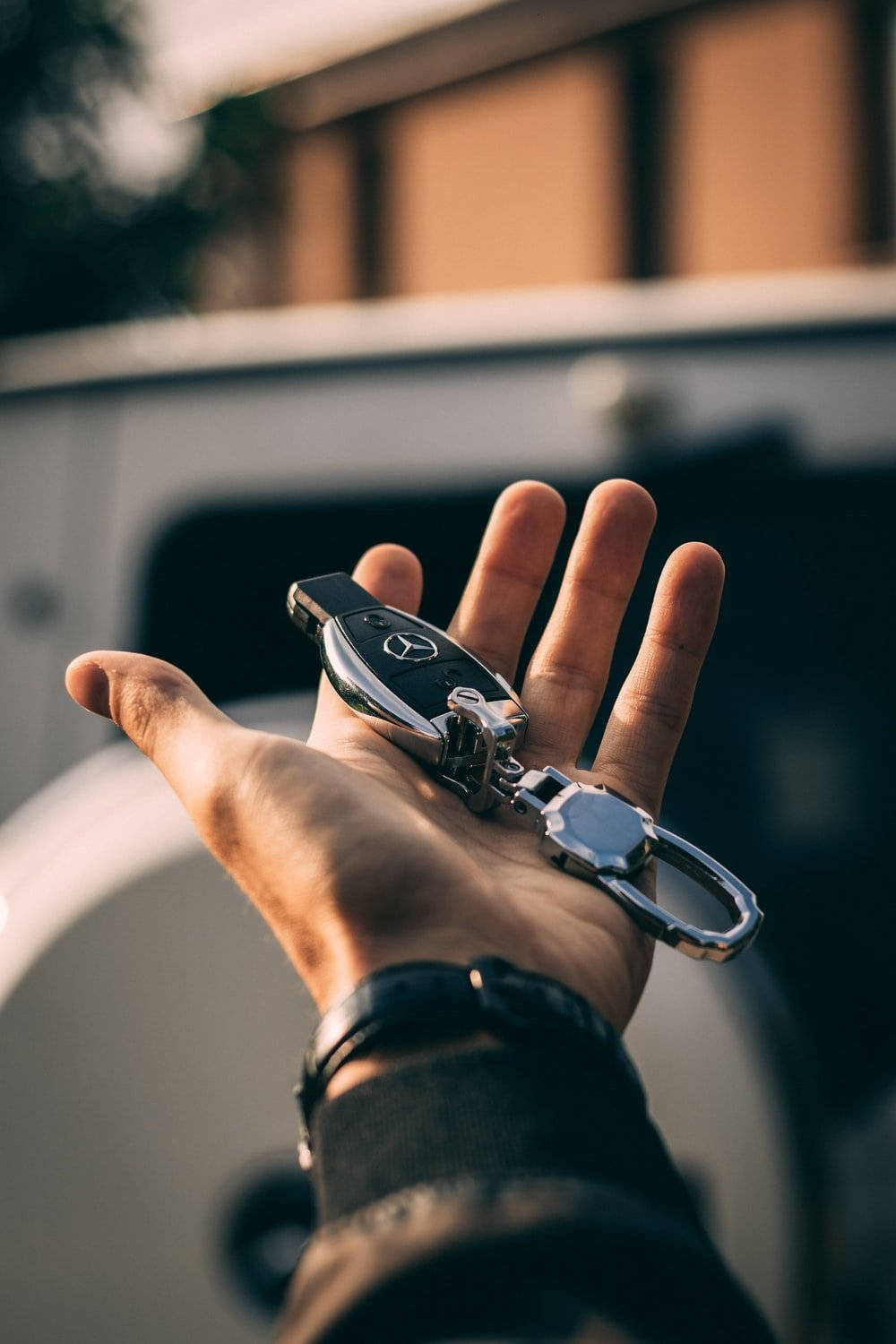 Hand Holding Mercedes Benz Car Key Wallpaper