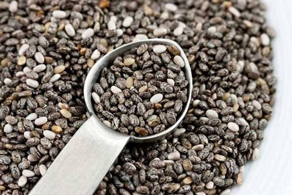 Healthy Chia Seeds In A Steel Measuring Spoon Wallpaper