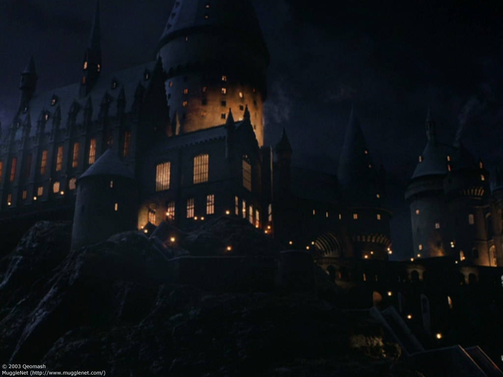 Hogwarts Castle Illuminated At Night Wallpaper