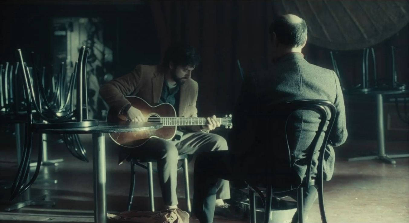 Inside Llewyn Davis Playing Guitar Wallpaper