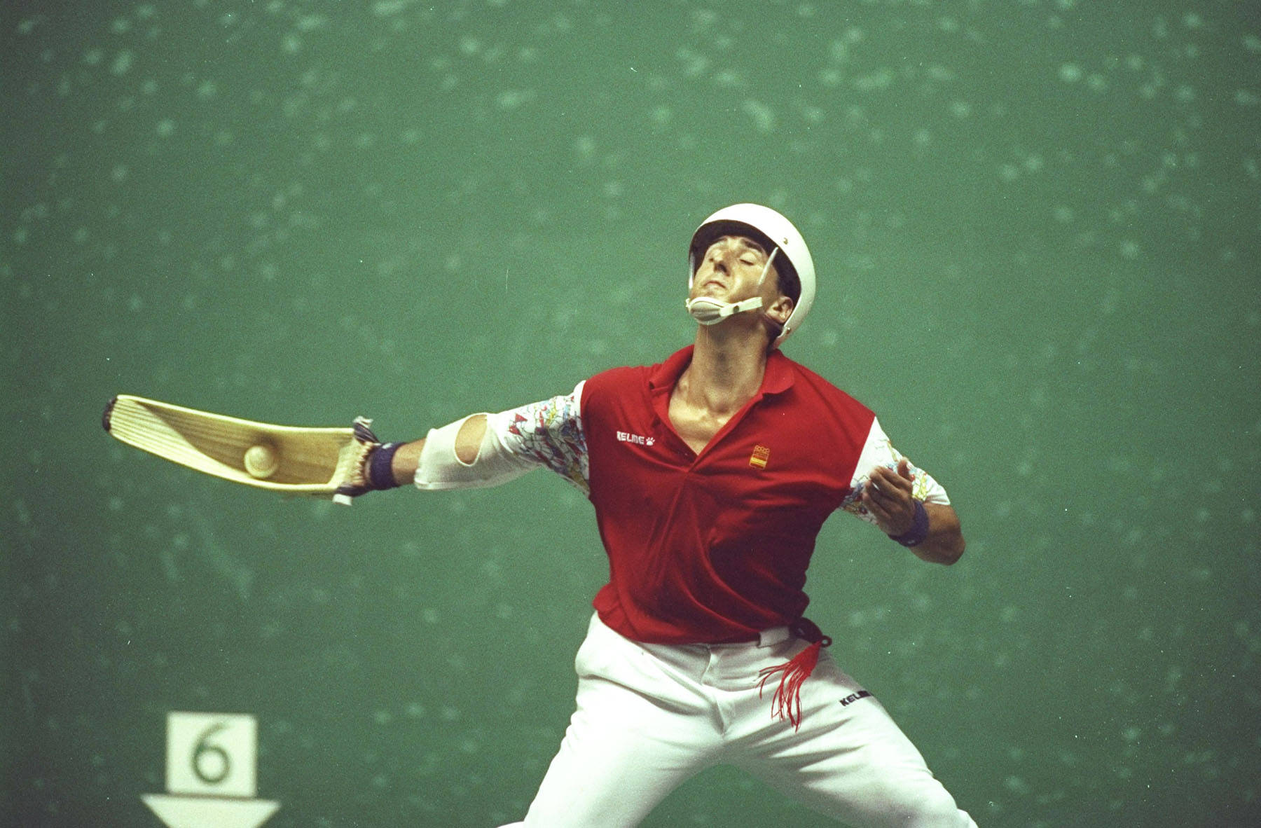 Intense Action Shot Of The Fastest Jai Alai Player Wallpaper