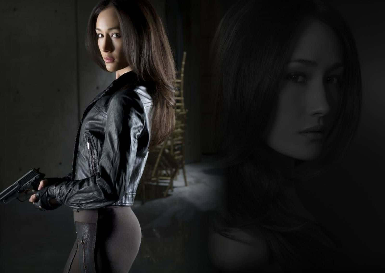 Intriguing Maggie Q Posing For A Photoshoot Wallpaper