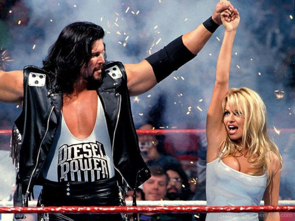 Kevin Nash Sharing A Ring Moment With Pamela Anderson Wallpaper