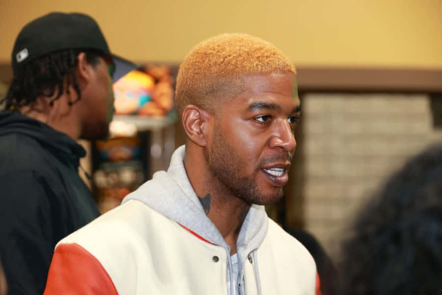 Kid Cudi Blonde Hair Casual Event Wallpaper