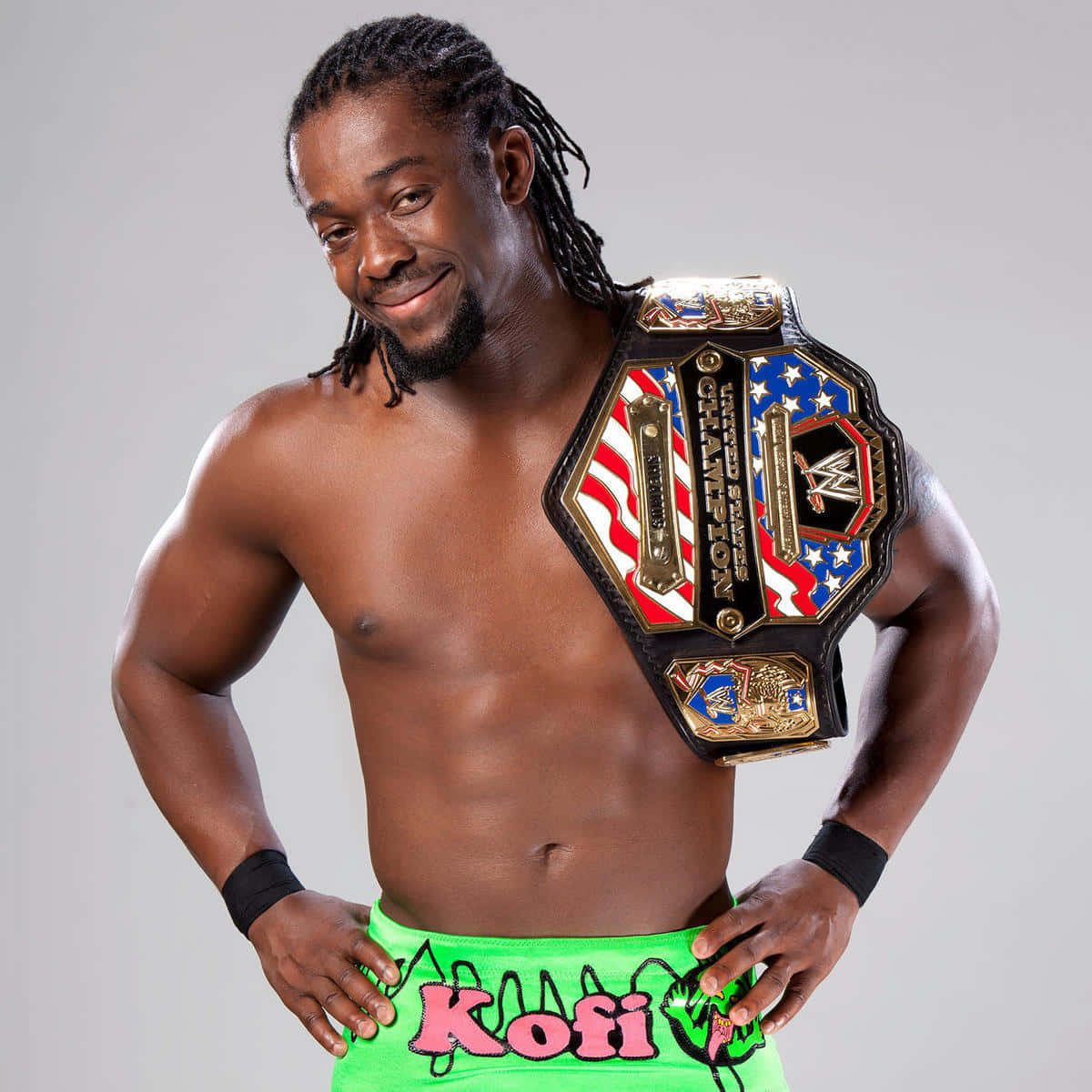 Kofi Kingston Posing With His Wwe Belt Wallpaper