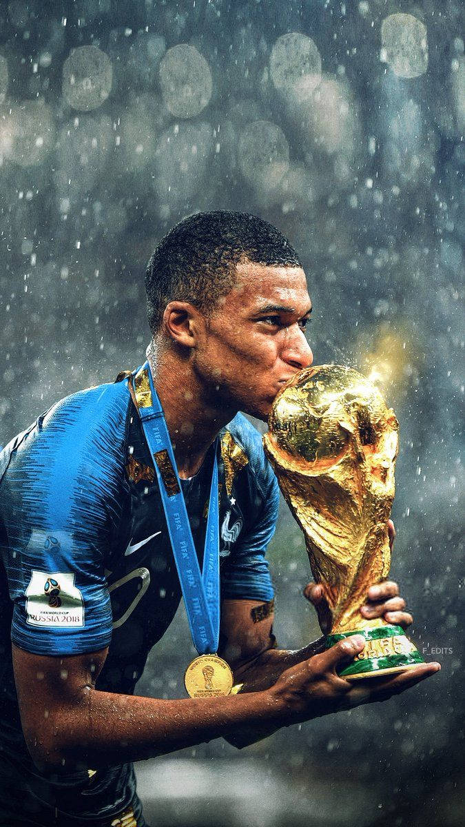 Kylian Mbappe Kissing World Cup Trophy Wallpaper