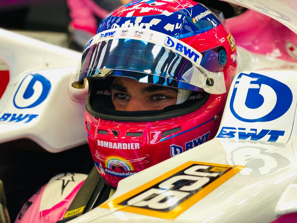 Lance Stroll Donning A Pink Racing Helmet Wallpaper