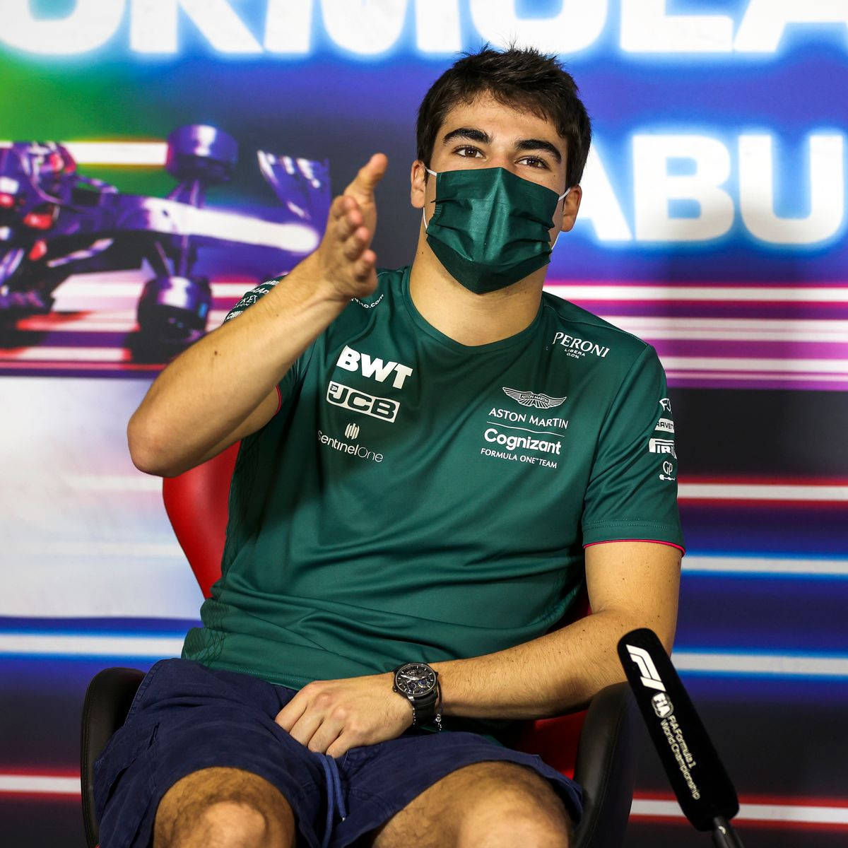 Lance Stroll Speaking At A Press Conference In Abu Dhabi Wallpaper