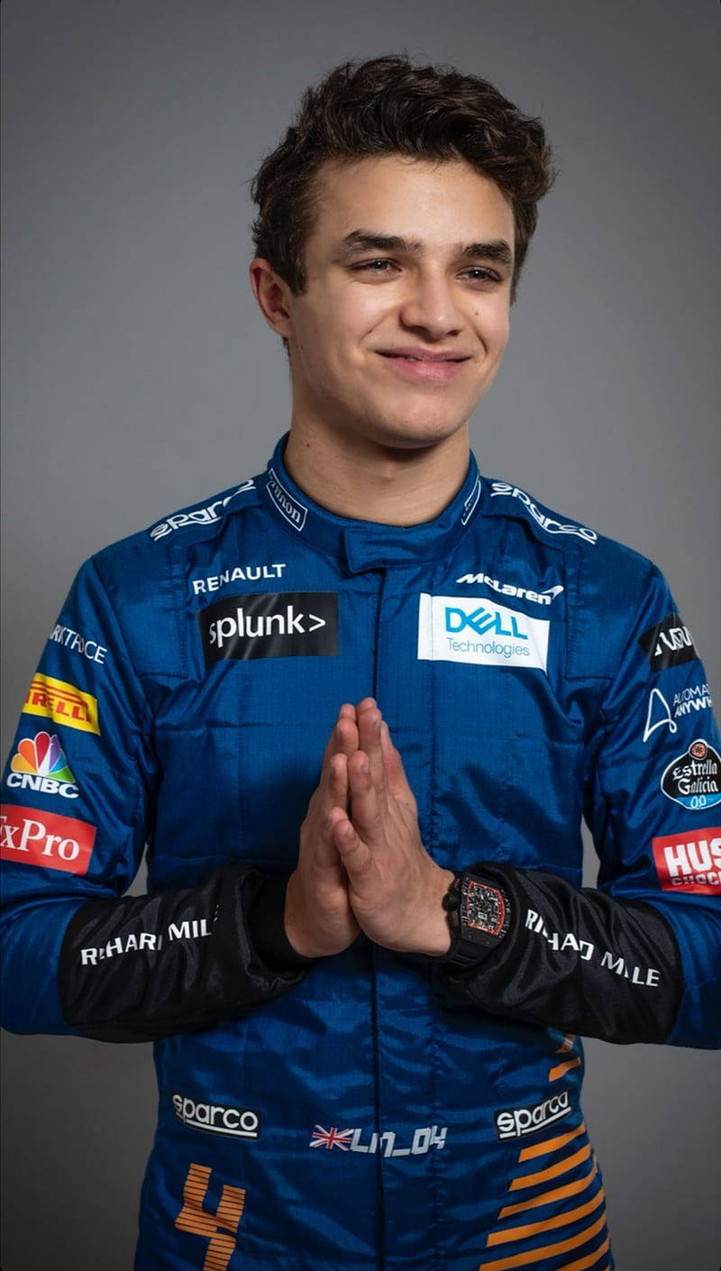 Lando Norris In Blue Uniform Wallpaper