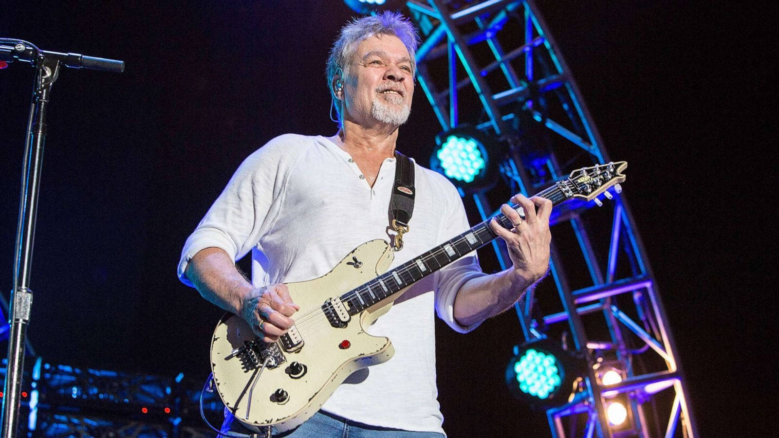 Legendary Guitarist Eddie Van Halen In Spotlight Wallpaper