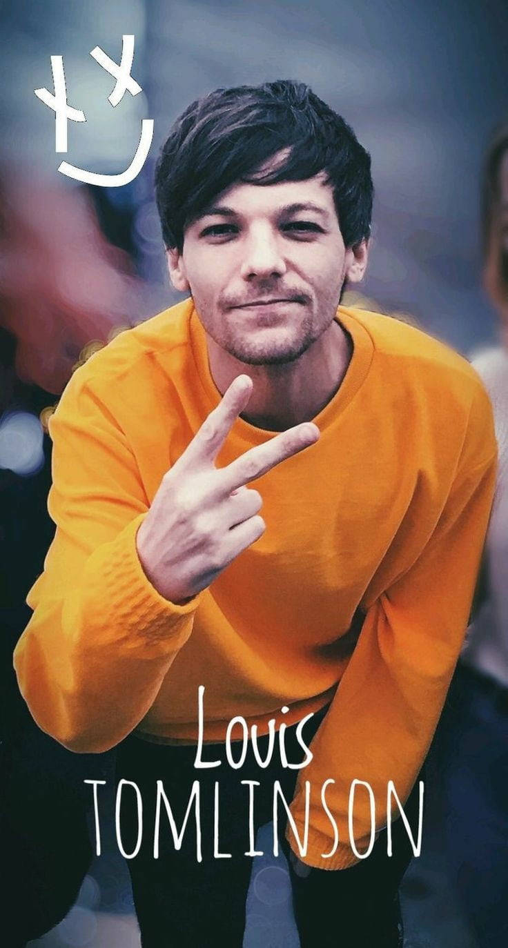 Louis Tomlinson Wearing A Yellow Sweater Wallpaper