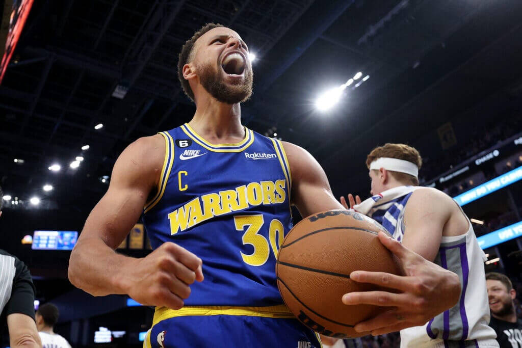 Low-angle Photo Of Steph Curry Celebrating Wallpaper