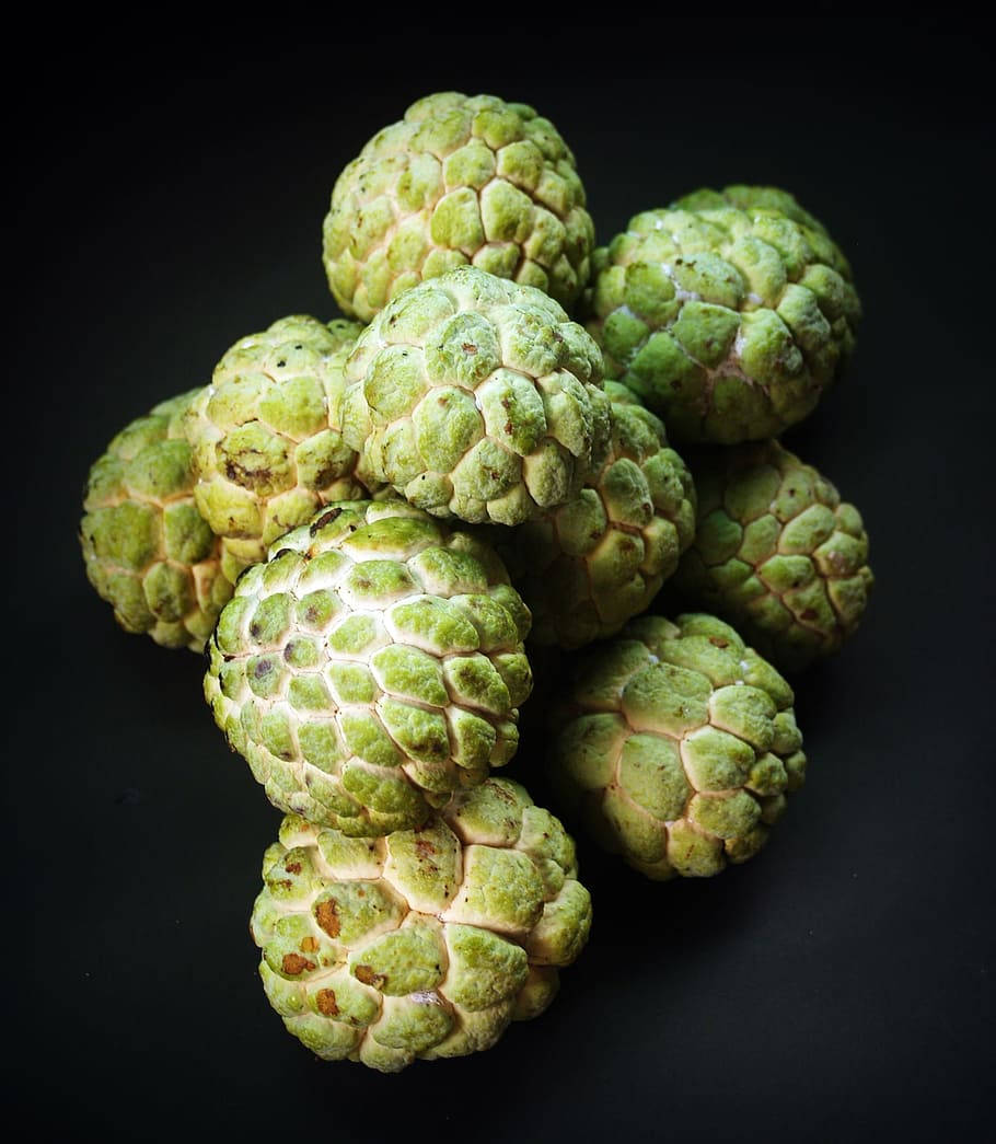 Luscious Custard Apples On A Dark Backdrop Wallpaper