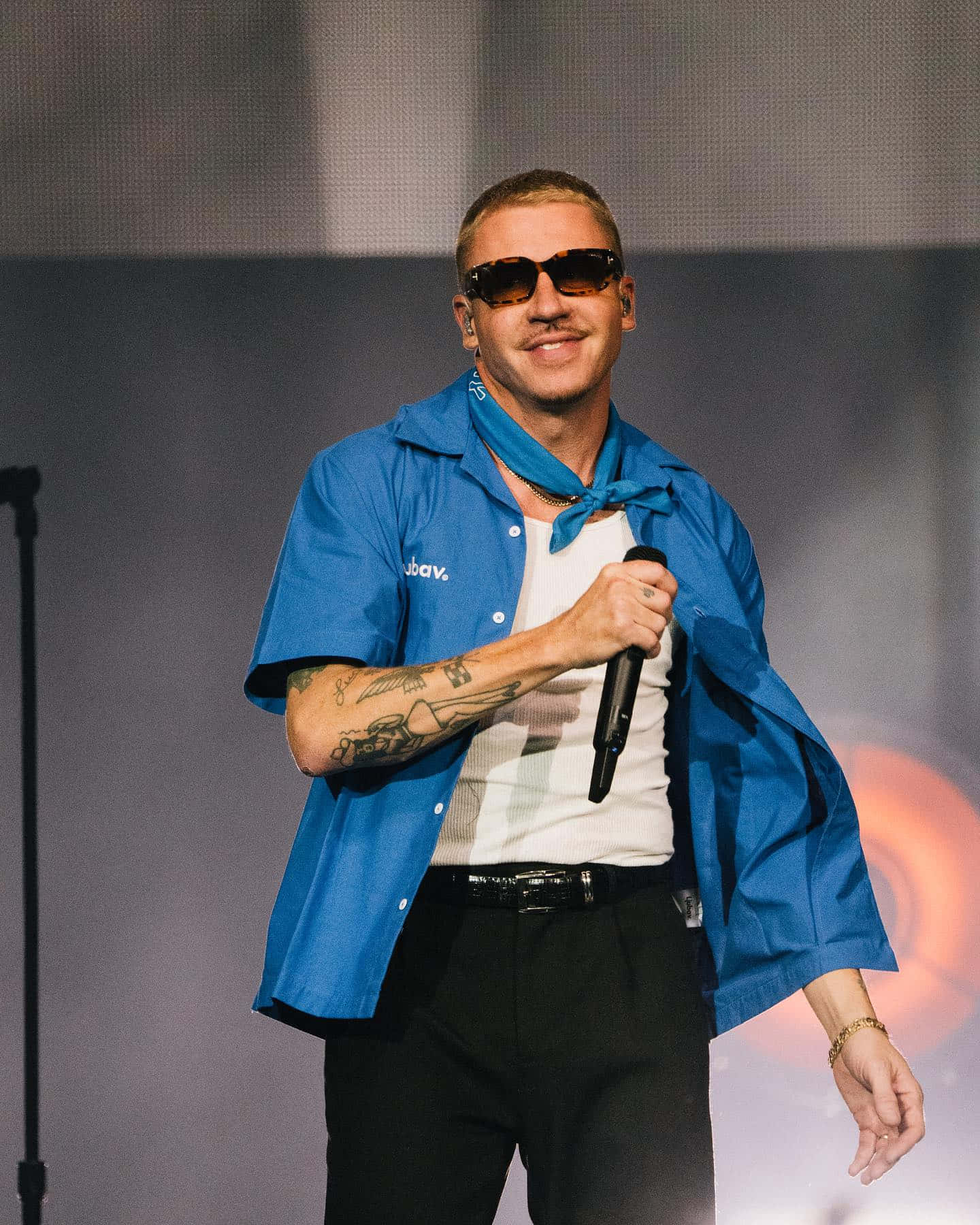 Macklemore Performingon Stage Wallpaper