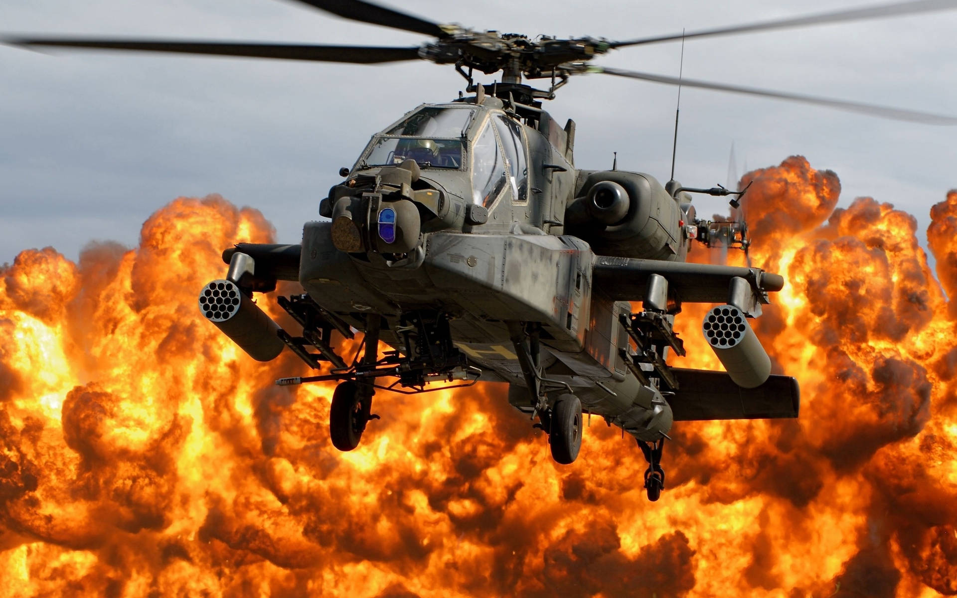 Magnificent Display Of An Apache Military Helicopter In Flight Wallpaper