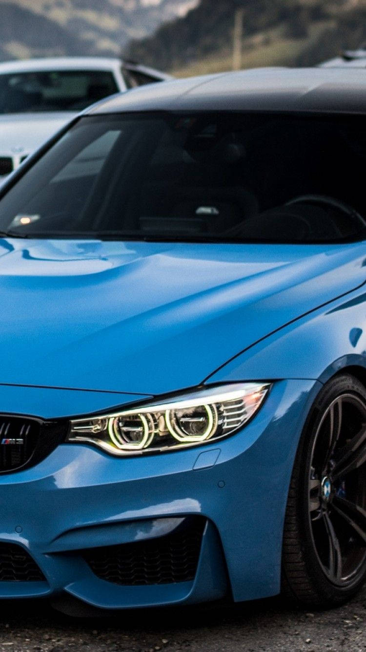 Majestic Blue Bmw In Close-up View Wallpaper