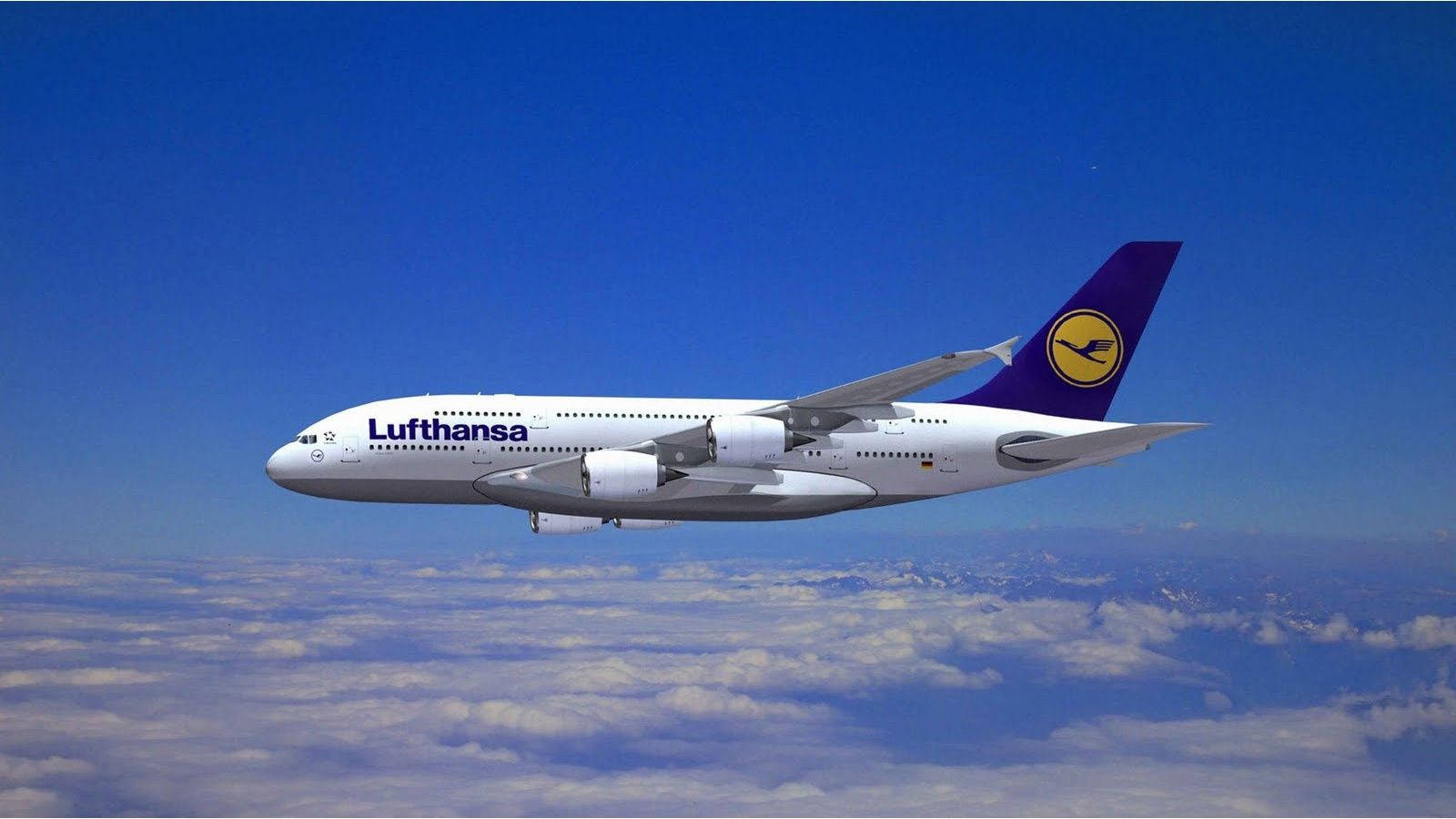 Majestic Lufthansa Aircraft Soaring In The Skies Wallpaper