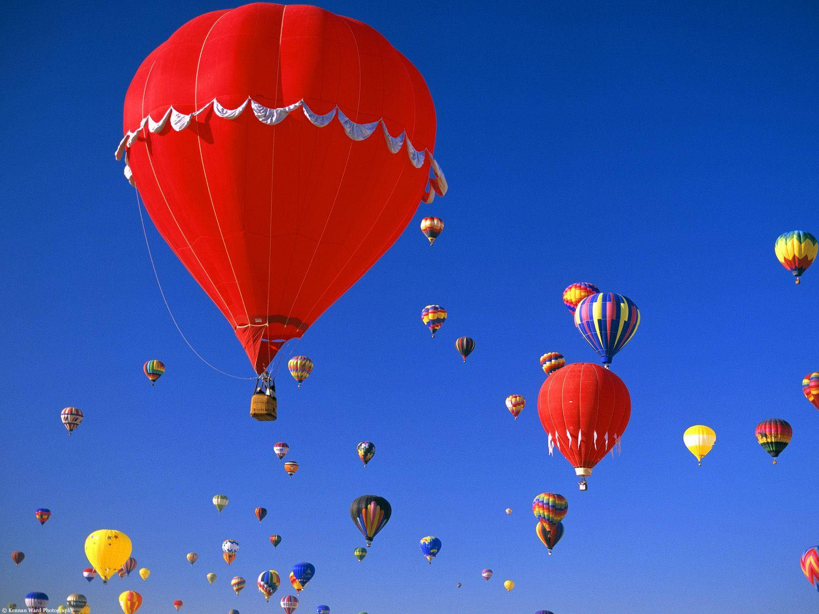 Majestic Red Hot Air Balloons Soaring Over Albuquerque Wallpaper