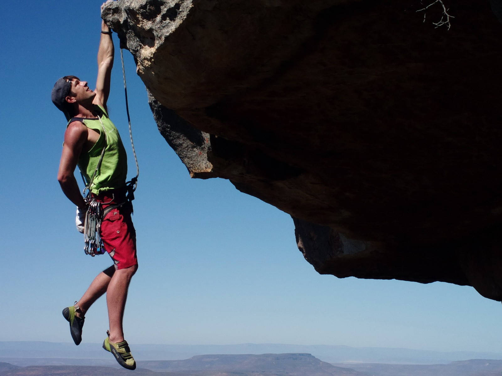 Man In One Hand Rock Climbing Wallpaper