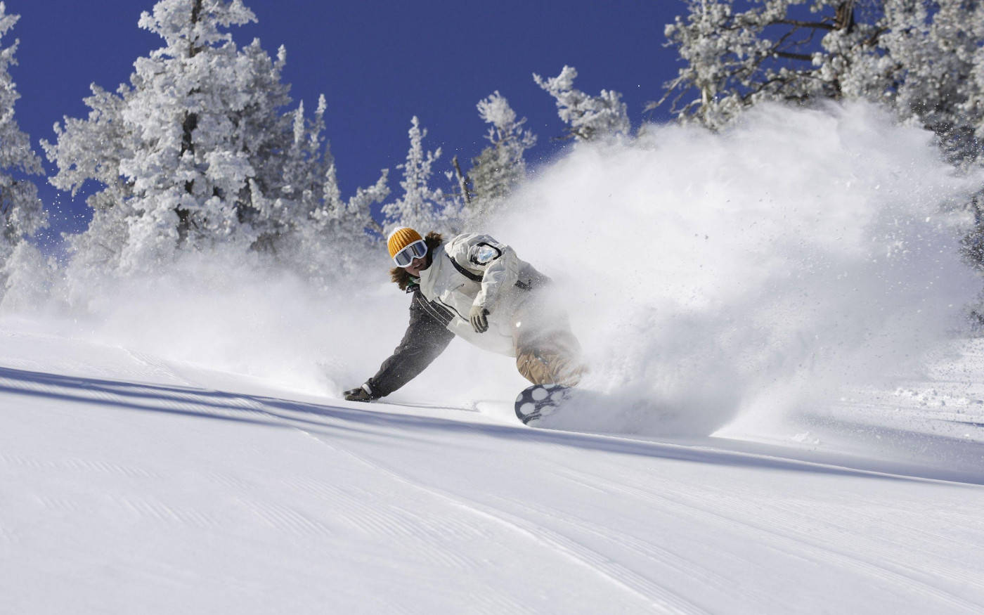 Man In White Descending With Snowboard Wallpaper