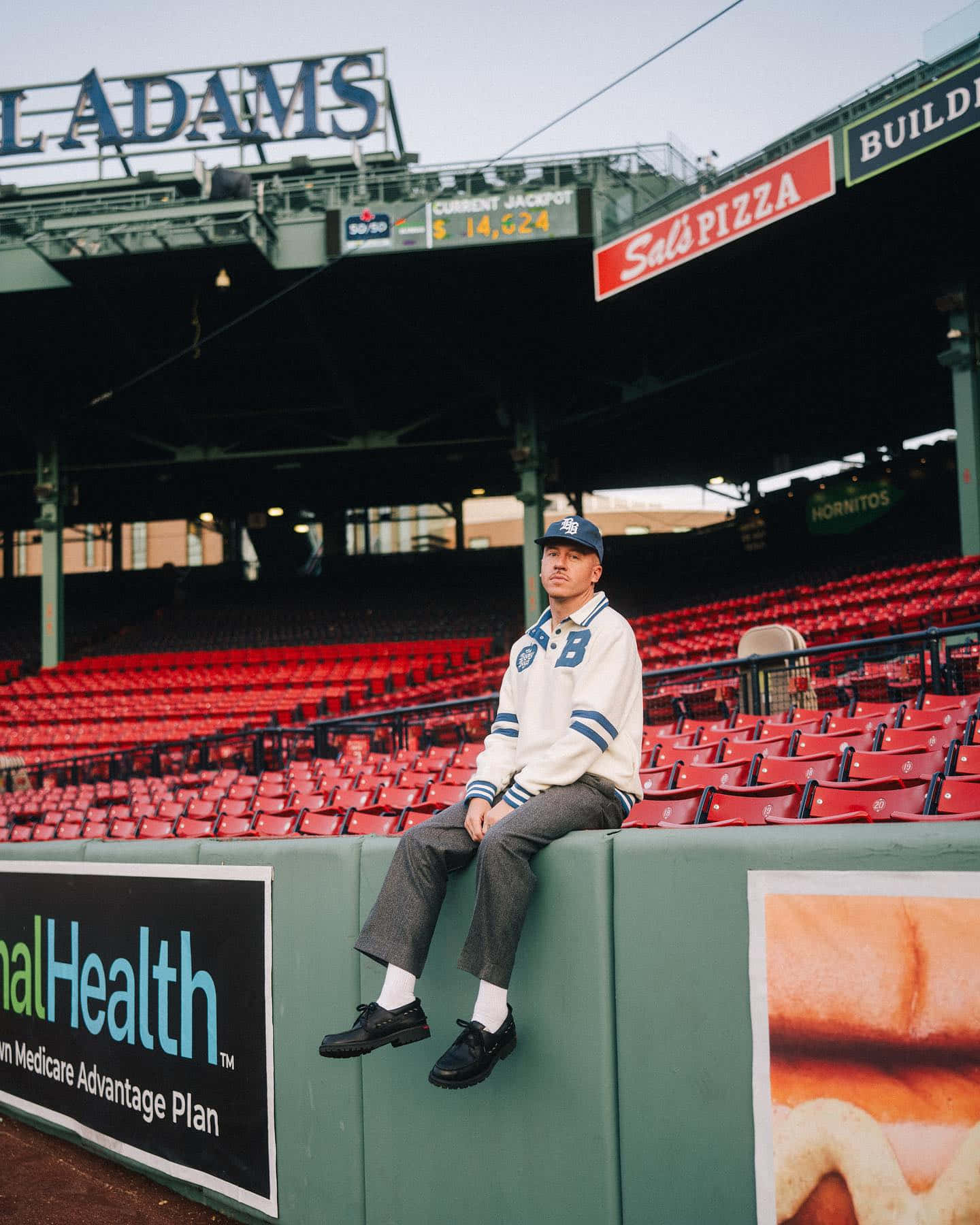 Man Seatedat Baseball Stadium Wall Wallpaper