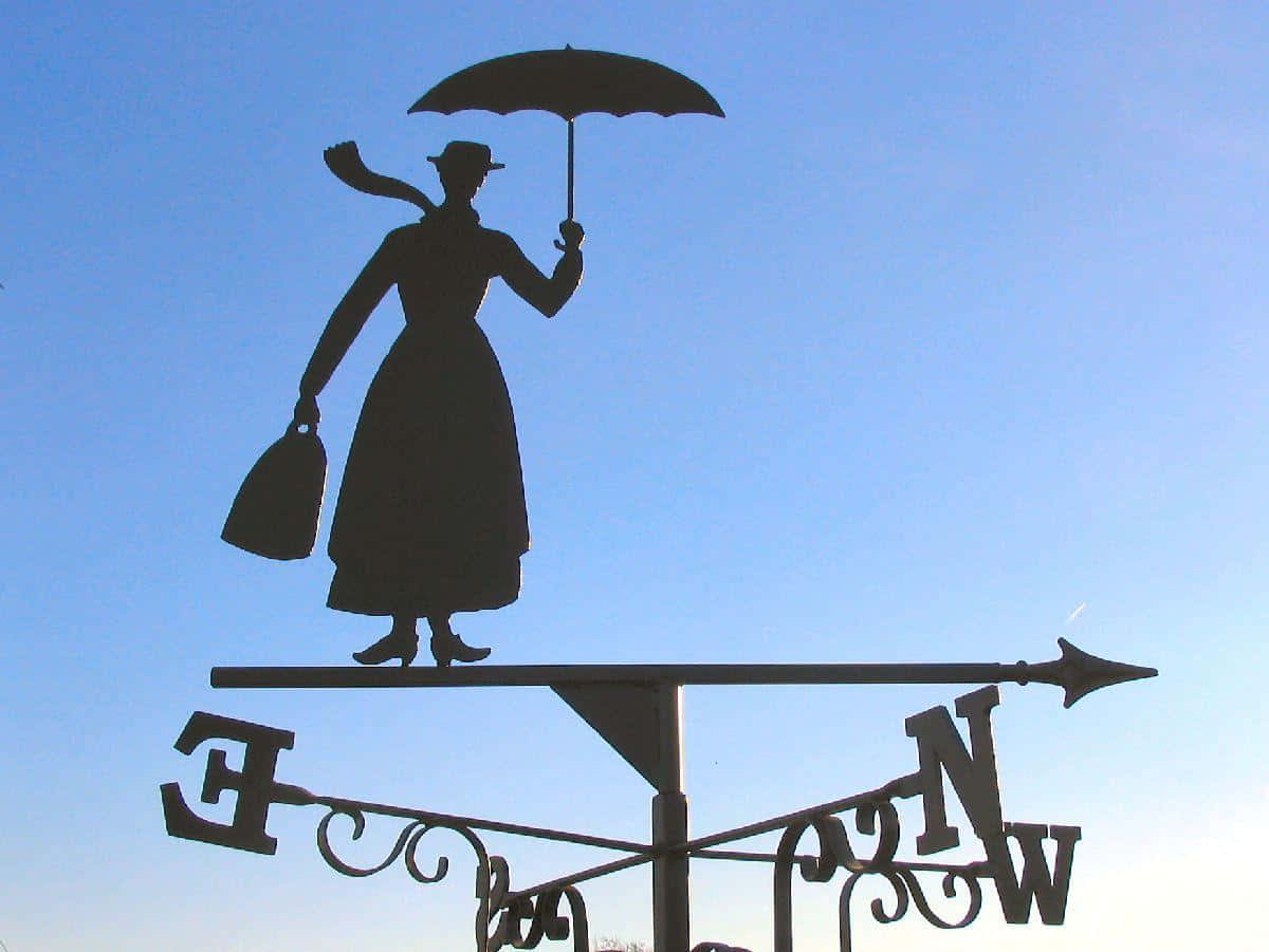 Mary Poppins With Her Magical Umbrella Flying Over London Wallpaper