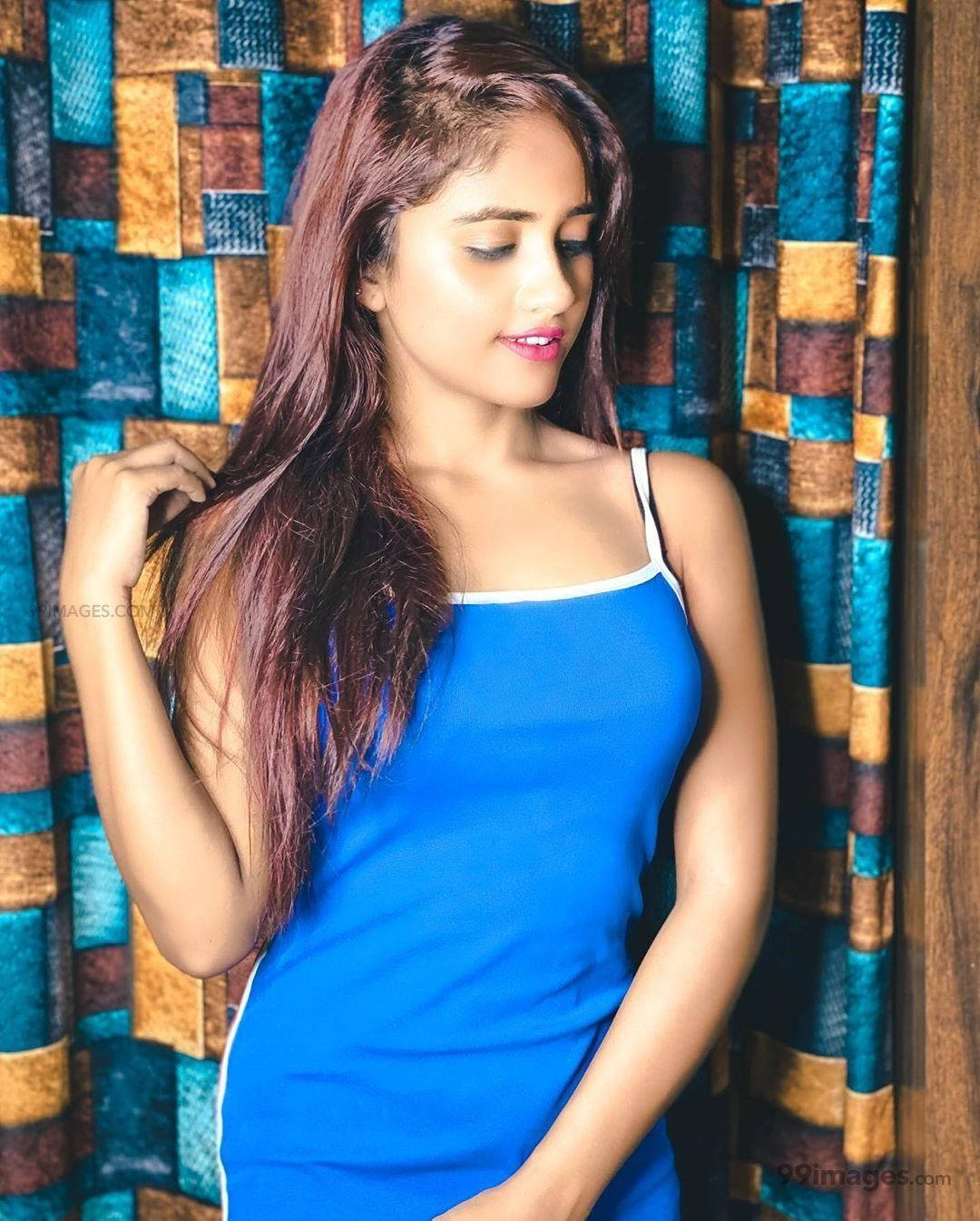Nisha Guragain In Blue Sleeveless Top Wallpaper
