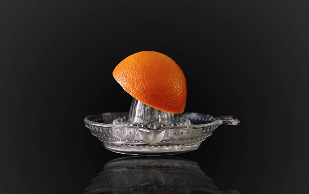 Orange On A Juicer Reamer Wallpaper