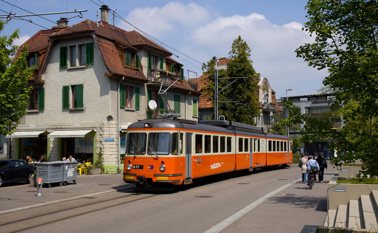 Orange Tram In Urban Street Wallpaper