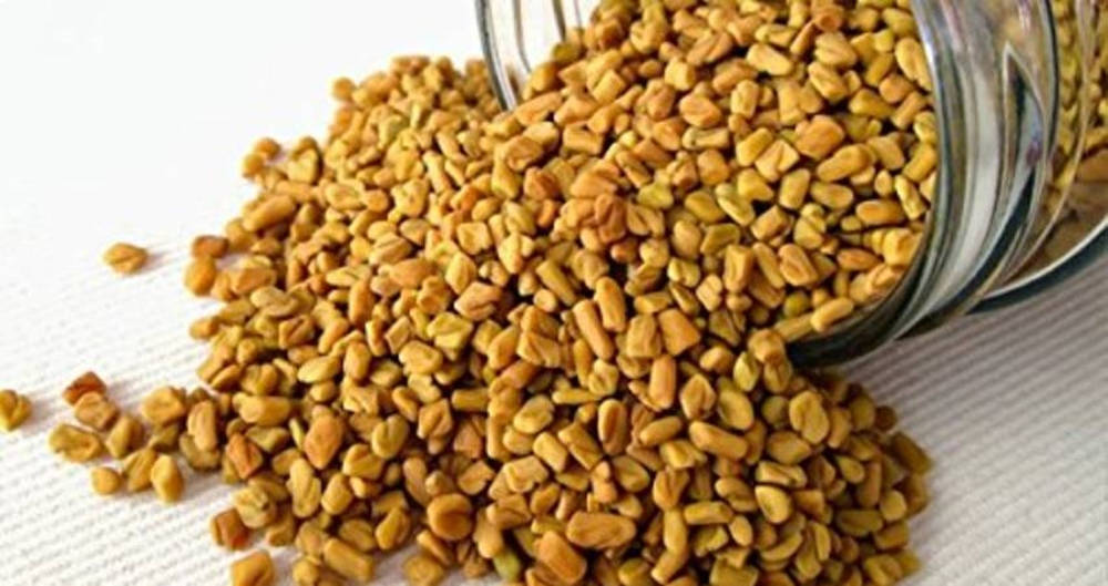 Overflowing Jar Of Fenugreek Seeds On Rustic Wooden Table Wallpaper